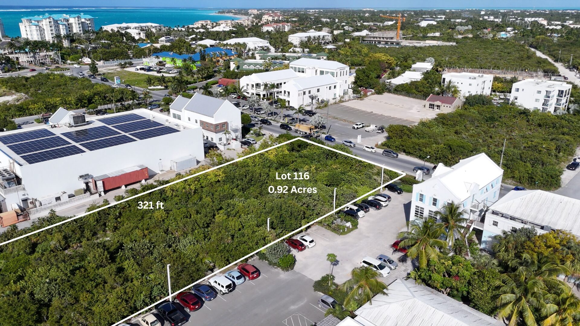 Looking along the full depth of the site, the only undeveloped land in view, toward the ocean